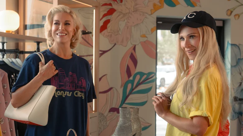 Screenshot from Season 4 episode 1 of Ted Lasso, showing Rebecca and Keeley's characters standing in a clothing shop.