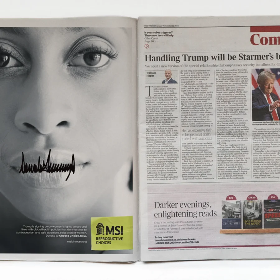 An open magazine pairs a close-up face with the Signed Away creative and a yellow MSI reproductive choices label beside a newspaper article about Trump; stark, critical tone.