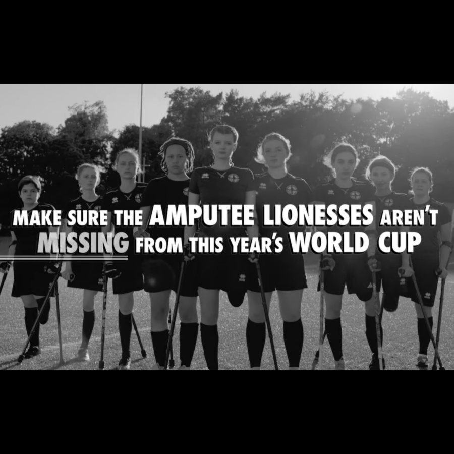 Black-and-white photo of women amputee footballers standing with crutches on a pitch, overlaid with a call to include the Amputee Lionesses in this year’s World Cup. Determined, empowering tone.