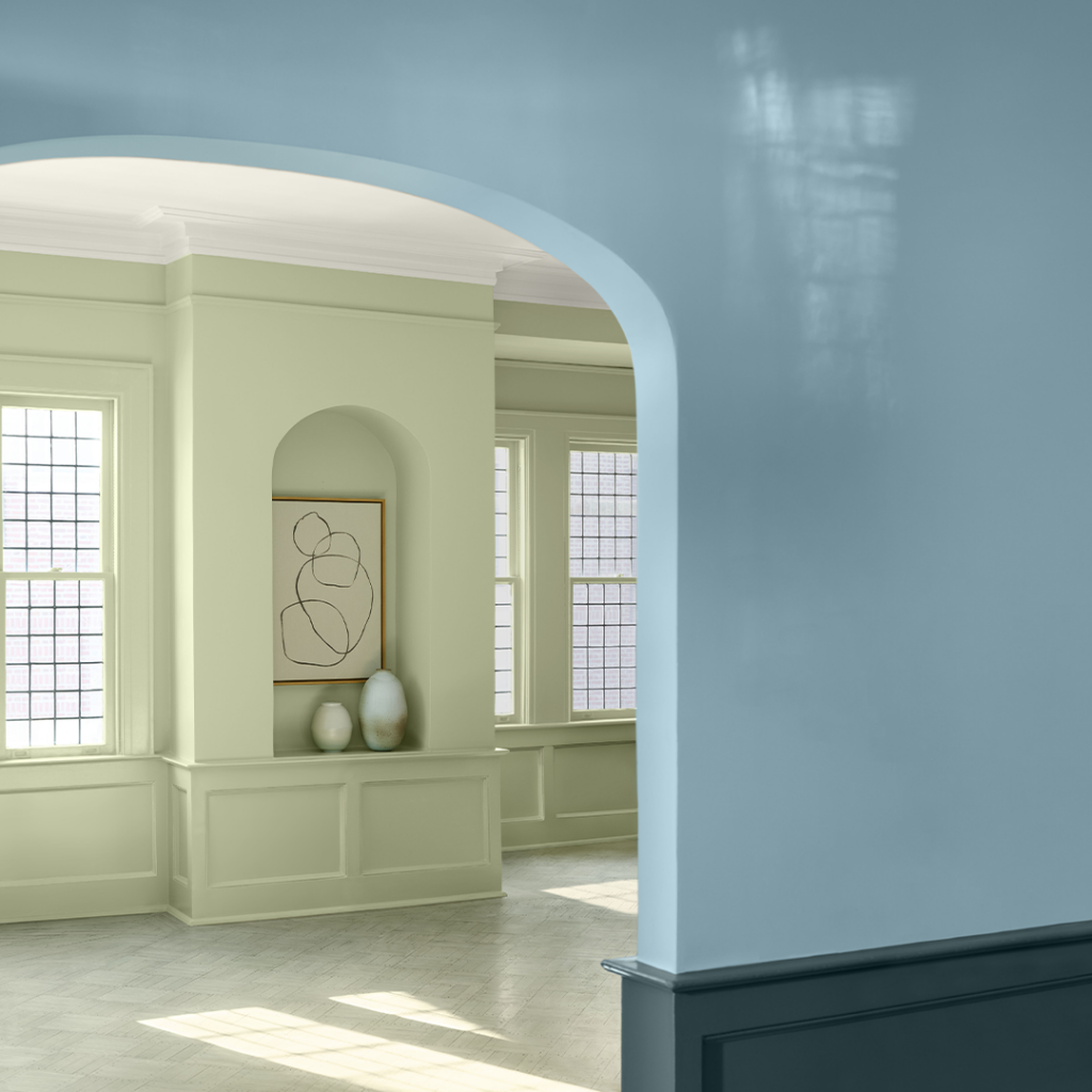 A living room is painted green and blue with Benjamin Moore paints